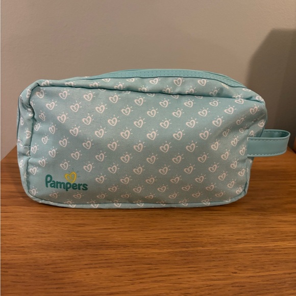 pampers Handbags - Pampers On The Go Patterned Pouch Bag
